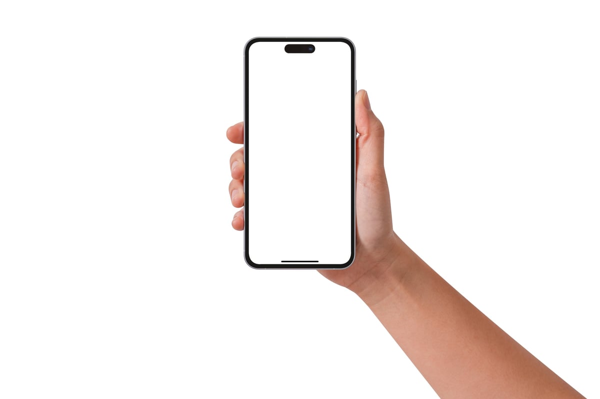 Hand holding a smartphone with a blank screen, technology concept