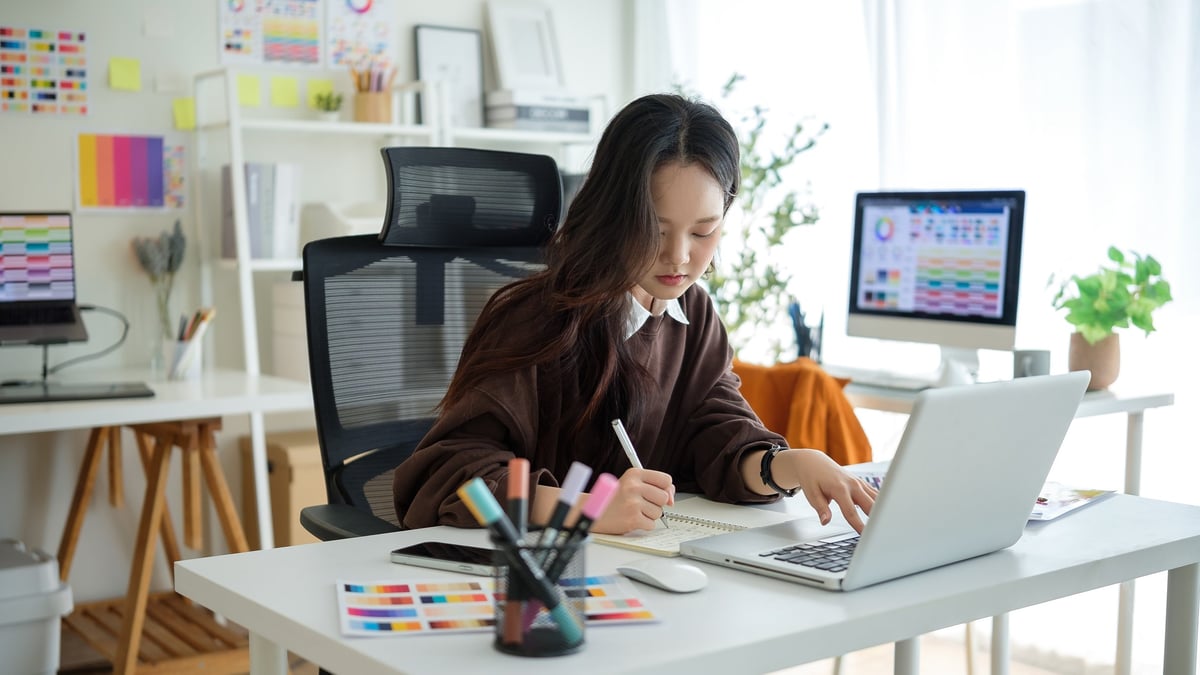Graphic designer working on web design project in creative studio environment