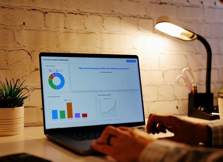 Business owner reviewing analytics dashboard with charts and graphs, representing small business performance metrics and data insights