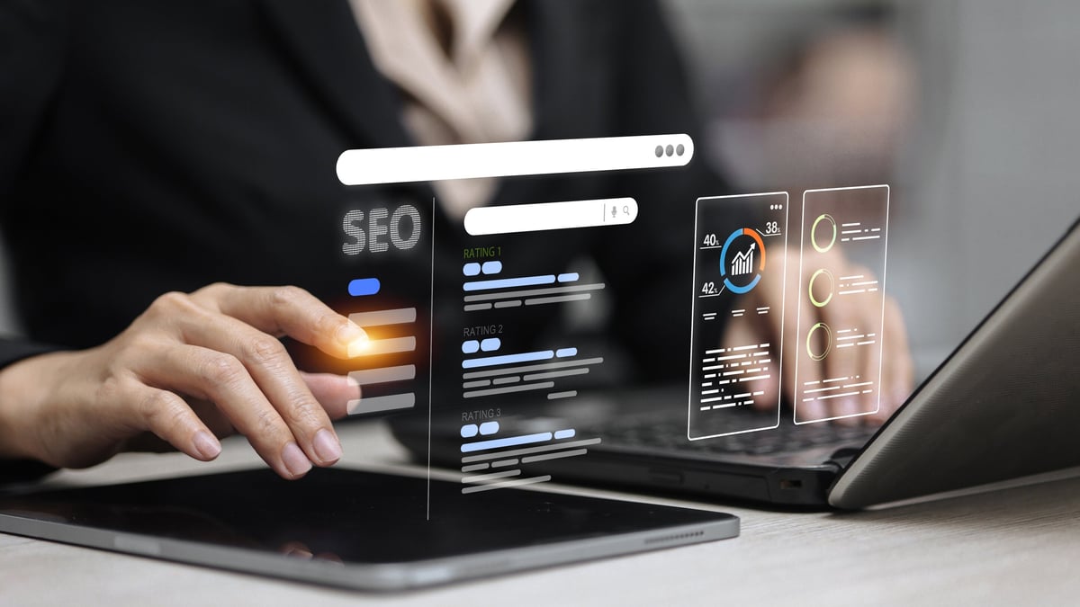 Businessperson analyzing an SEO dashboard with keyword rankings