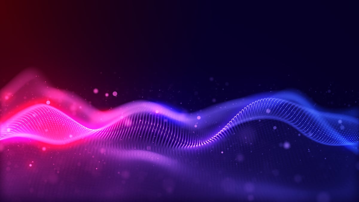 Abstract digital wave background with neon gradient colors and glowing particles